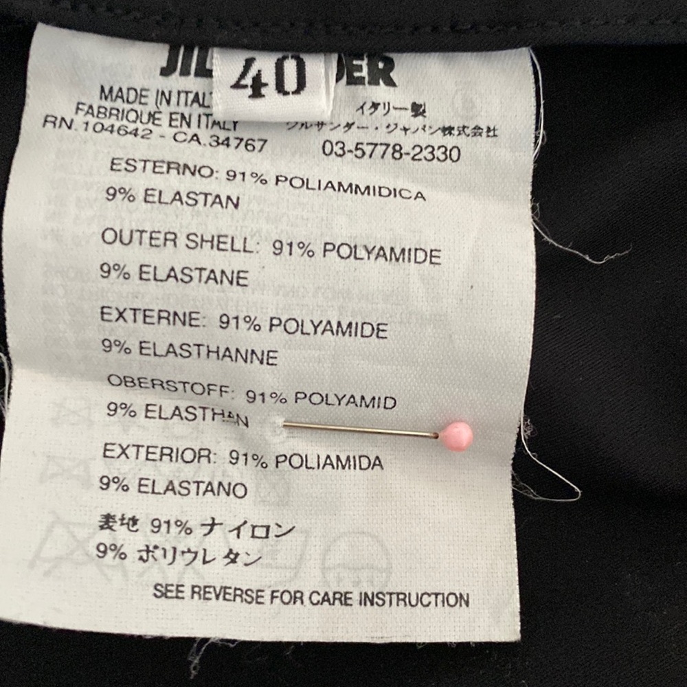 Adorable classic slim skirt. 10"front zipper leading to open pleat. 26" length